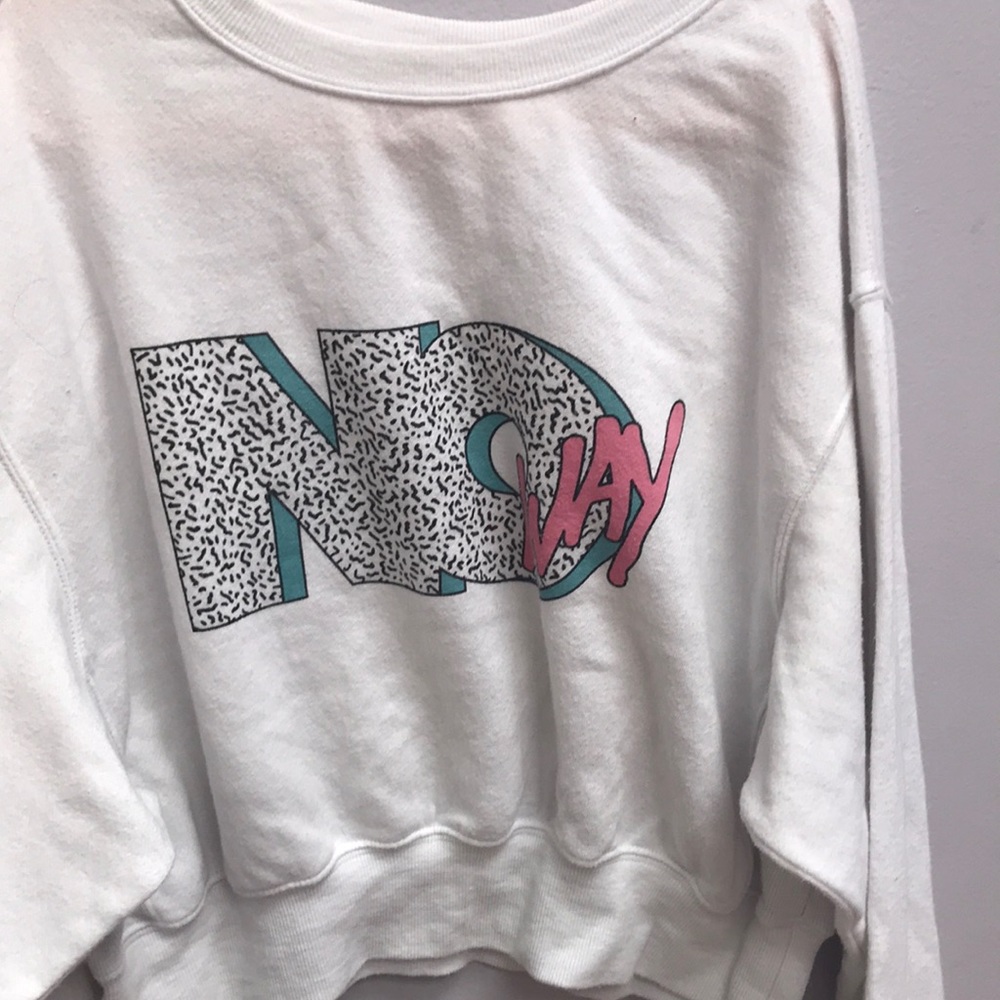 A garage cropped sweater